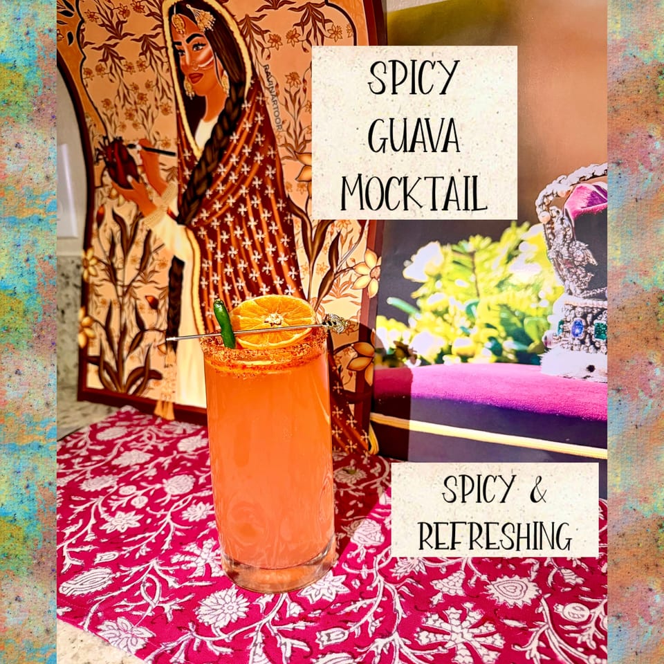 Spicy Guava Mocktail garnished with orange and chili, on a red floral placemat.